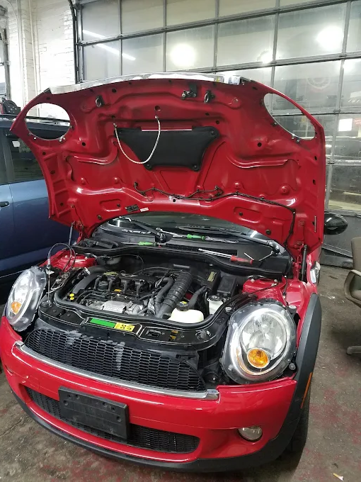 Vehicle being serviced inside the shop